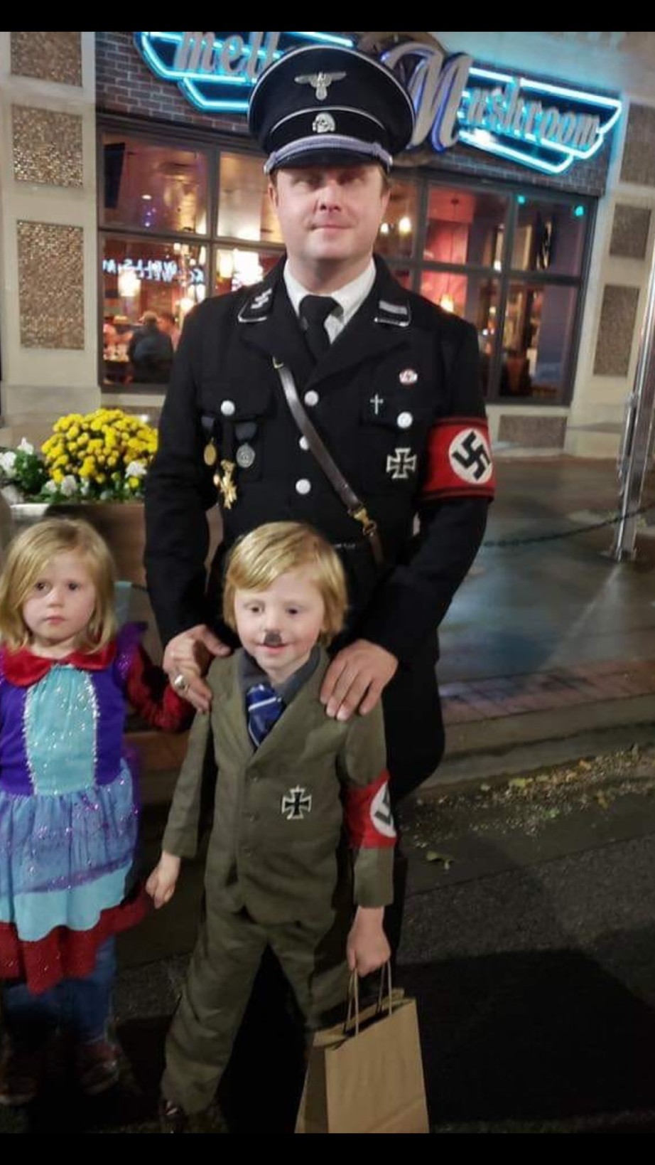 Guy dressed his child up as Hitler....