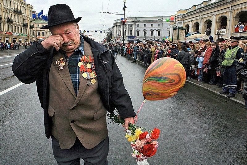 ww2 vet walking alone on victory day.